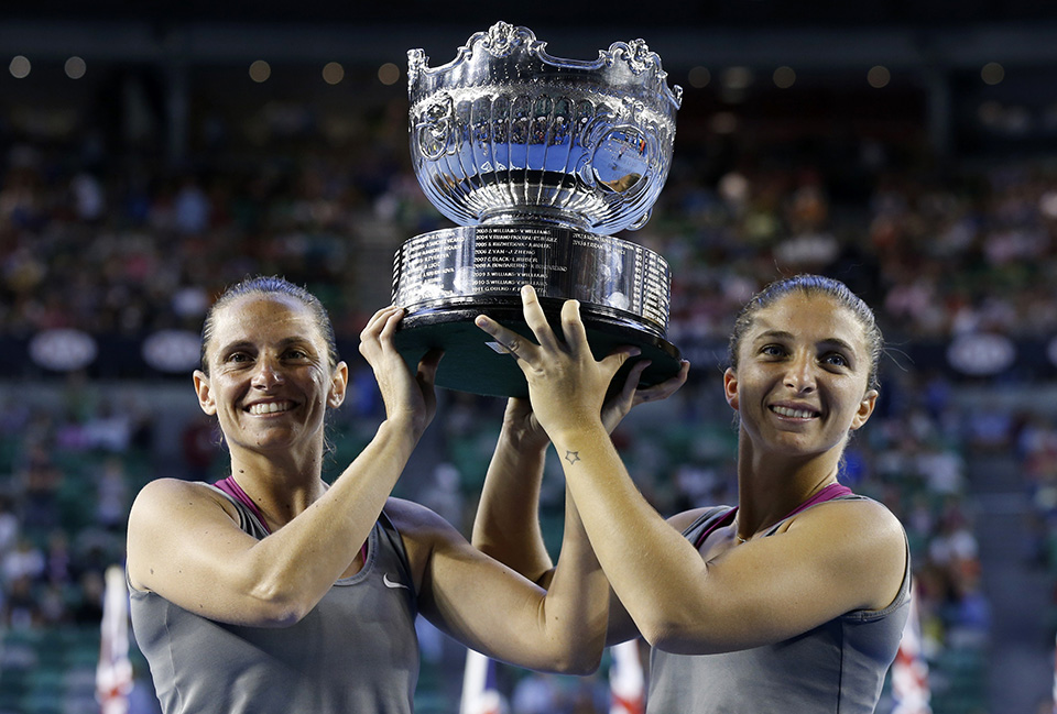 Sara Errani of Italy and Roberta Vinci of Italy pose with the trophy after defeating Ekaterina Makarova of Russia and Elena Vesnina of Russia
